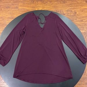 Express plum blouse.  Crisscross open back. Size: Medium